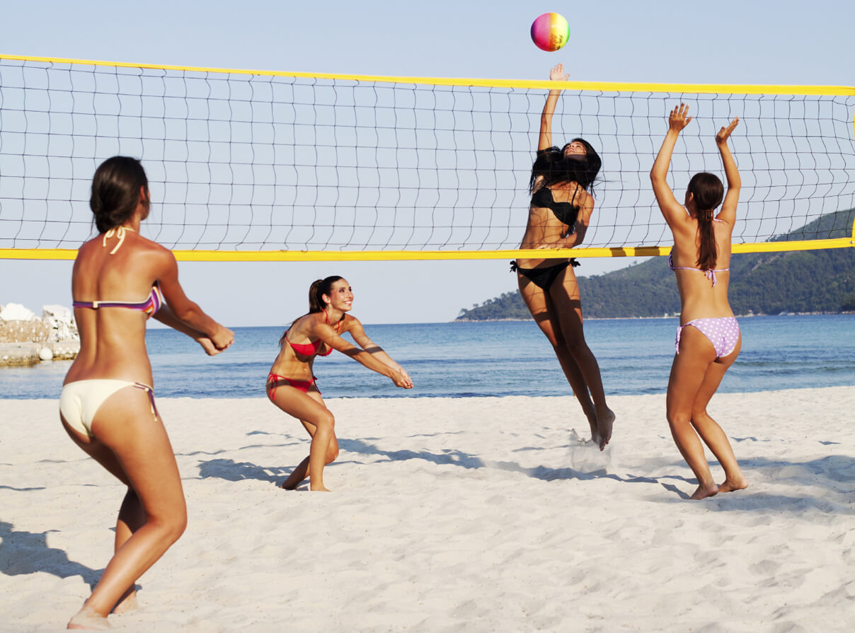 Group of people playing beach volleyball